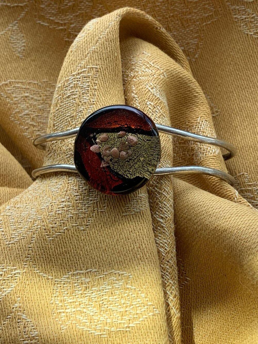 Art glass and stainless steel cuff bracelet in amber black and gold